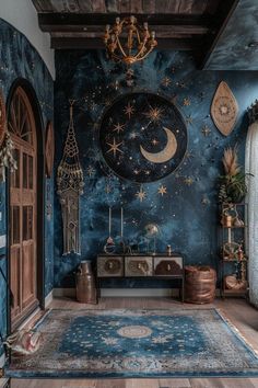 a blue room with stars and moon designs on the walls, rugs and other decorations