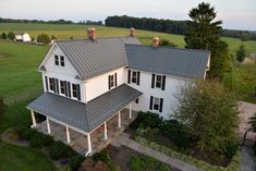 an aerial view of a large white house