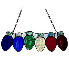 a multicolored stained glass window hanging from a chain