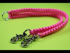 a pink leash with two metal hooks on it