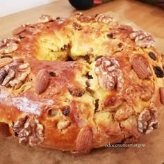 a cake with nuts and raisins on it