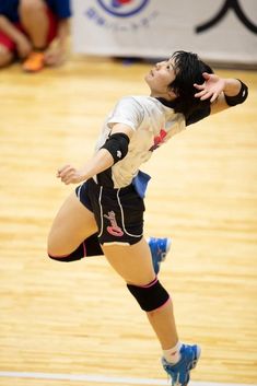 a female volleyball player in action on the court