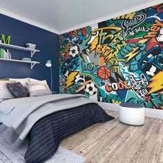 a bedroom with blue walls and graffiti wallpaper