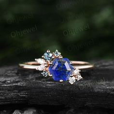 "This is a natural Lapis Lazuli engagement ring in solid gold,about 6x6mm Hexagon. The accent stones are moissanites and alexandrites. The band width is about 1.4mm. It can be made in any ring size. However please contact me to custom make it to a special big or small size. It can be made in white gold,rose gold or yellow gold with 14k or 18k. However for some people who are nickel allergic,I can also make it to 925 sterling silver to make you can wear it. The ring is handmade,very high quality! Lapis Ring Engagement, Cluster Engagement Ring Silver, Lapis Wedding Ring, Lapus Lazuli Engagement Ring, Lapis Lazuli Ring Gold, Lapis Lazuli Wedding Ring, Lapis Engagement Ring, Lapis Lazuli Ring Vintage, Lapis Lazuli Gemstone Ring