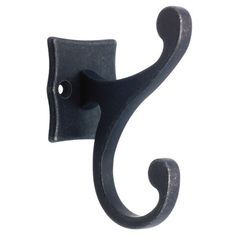 a black metal hook on the side of a white wall with a swirly design