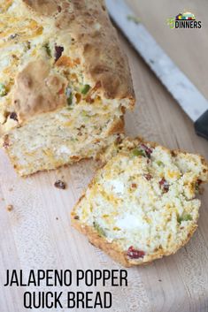 a loaf of jalapeno popper quick bread on a cutting board