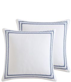 two white pillows with blue trims on each pillowcase, one is square and the other is rectangleed