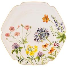 a white plate with flowers painted on it