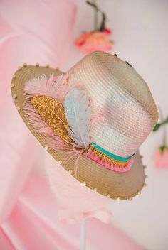 Beachy glam meets bird-brained whimsy in our Island Bird Sun Hat. Stay cool and stylish with this gold and multicolor hat, featuring a blue, gold, and pink feather combo and a turquoise, gold, and pink band. Complete with a sparkle-filled gold bird patch. (Feeling fly yet?) This hat is ONE OF A KIND, created by our owner Stephanie. To receive item quicker, expedited shipping is available at checkout Adjustable Pink Hat Bands For The Beach, Adjustable Pink Hat Band For Beach, Beaded Multicolor Beach Hats, Pink Beach Hat Bands, Adjustable Pink Hat With Feather Trim, Gold And Pink, Pink Feathers, Sun Hat, Stay Cool