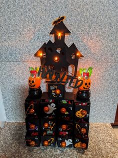 halloween decorations on display in front of a wall