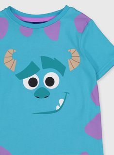 a blue t - shirt with an image of a monster on it's chest