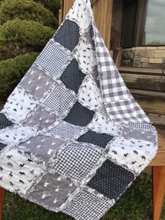 a black and white checkered quilt on a wooden chair