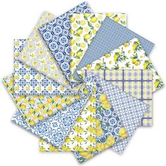 a bunch of papers with lemons and blue flowers on them, all in different colors