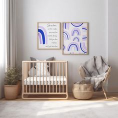 a baby's room with two pictures on the wall and a crib next to it