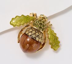 Add instant charm (and subtle symbolism) to any fall outfit with this buzz-worthy acorn bee pin designed with accented with transparent brown and green epoxy and olive green crystals. From the Joan Rivers Classics Collection®. Bee Pin, Crystal Eye, Brown And Green, Joan Rivers, Jewelry Pins, Duffel Bag Travel, Silver Shop, Pendant Rings, Green Crystals