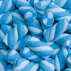 blue and white striped marshmallows are piled together