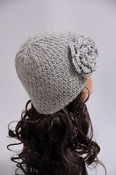 "Charming hat! This grey wool beanie hat features on an interesting pattern and a crochet flower on one side. It suits any outfit style. Length:8\" from top to bottom Circumference: 18\" (relaxed) 25\" (stretched) - fit any size head! Hand wash in cold water with detergent or shampoo and dry flat. If you are interested in an item but would prefer a different color or size, feel free to contact me and I will create a custom design for you." Gray Crochet Hat One Size Fits Most, Casual Hand Knitted Gray Crochet Hat, Hand Knitted Gray Crochet Hat One Size, Gray Hand Knitted Crochet Hat One Size, Warm Gray Yarn Crochet Hat, Gray Yarn Crochet Hat, Gray Crochet Hat Made Of Yarn, Handmade Gray Crochet Hat For Winter, Hand Knitted Gray Crochet Hat