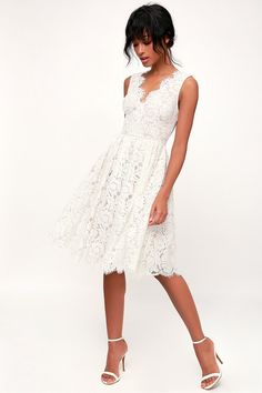 a woman is wearing a white dress and high heeled shoes, with the caption click here for 10 % off