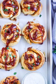 some food is sitting on a tray with sauce and ketchup in the middle