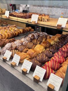 many different types of baked goods on display