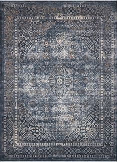 a blue and gray rug with an ornate design on the bottom, in front of a white background