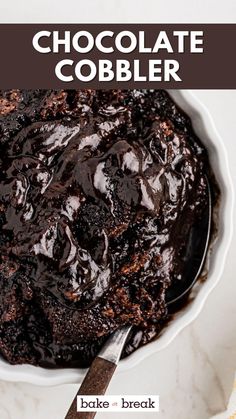 chocolate cobbler cake in a white bowl with a spoon on the side and text overlay