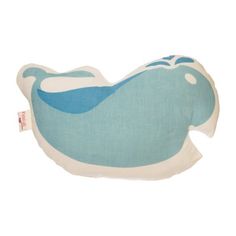 a blue and white whale pillow on a white background