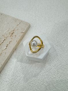 Welcome to PearlologyBoutique! Super High iridescent luster near round shape white south sea pearl in the size about 8mm rested on a minimalist design 14k gold vermeil textured band with. It is very rare to see this small size south sea pearl,especially with such beautiful luster. You won't be disappointed when you see the luster of this pearl. 💛Pearl Type: White South Sea Pearl 💛Pearl Size: Approx 8mm 💛Color: White, cream 💛Shape: Near round 💛Surface: see video and pictures  💛Band: 14k gol Gold Pearl Charm Open Ring, Gold Pearl Ring With Charm For Gift, Gold Round Pearl Charm Ring, South Sea Pearl Ring, Saltwater Pearls, Sterling Silver Rings Bands, Gift For Sister, Sea Pearl, South Sea Pearls