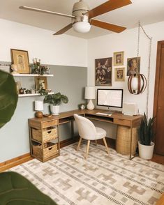 a room with a desk, chair and pictures on the wall above it is also a ceiling fan