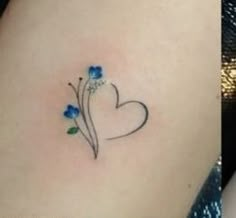 two pictures of the same tattoo on one side of the stomach, and an image of blue flowers on the other