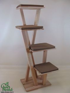 the cat tree is made from wood and has three levels