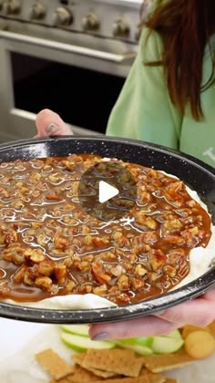 a person holding a tray with food on it