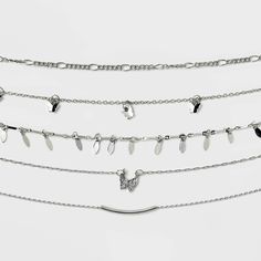 5-piece choker necklace set from Wild Fable™ makes a perfect pick for casual or dressier occasions. Varying designs range from simple linked chain to butterfly and bar charm. Made with silver-tone brass, the pieces close with lobster-claw clasps and come with extender chains for a customizable fit. If you're not satisfied with any Target Owned Brand item, return it within one year with a receipt for an exchange or a refund. Wild Fable™: A look for every story. Butterfly Choker Necklace, Butterfly Choker, Silver Choker Necklace, Choker Necklace Set, Silver Choker, Polymer Clay Projects, Bracelets Jewelry, Choker Necklaces, Clay Projects