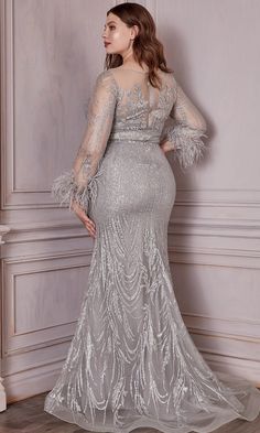 Enhance your visual appeal in this luxurious Cinderella Divine CB090C creation. Amazing embroidery in sheer fabric, this long evening dress features an illusion bateau neckline with sweetheart lining, long sleeves accented with feather fringes, and an illusion open back with zipper closure. The sheath skirt glimmers with lovely blossoms as it falls down into a full-length hemline in a sweep train. Look sophisticated and mature in this simple yet chic Cinderella Divine masterpiece. Whether you ar Long Gown With Sleeves, Anniversary Dresses, Fashion Types, Gown With Sleeves, Glitter Gown, Sheer Long Sleeve Dress, Formal Prom Dresses Long, Silver Gown, Cinderella Divine