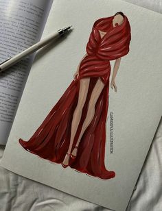 an open book with a drawing of a woman in a red dress on top of it