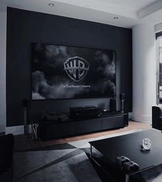 a living room filled with furniture and a flat screen tv mounted to the side of a wall