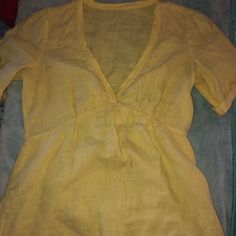 - Yellow Blouse - Slightly See Through - Never Worn - No Size On It But Would Fit A Extra Small Or Small Fitted V-neck Shirt For Beach, Fitted V-neck Shirt For The Beach, Stretch V-neck Shirt For Spring, Fitted V-neck Beach Shirt, Summer V-neck Stretch Shirt, Yellow Stretch V-neck Blouse, Fitted Short Sleeve Summer Blouse, Yellow Linen Tops For Spring, Yellow Blouse