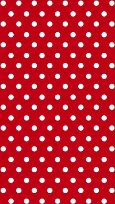 a red background with white polka dots