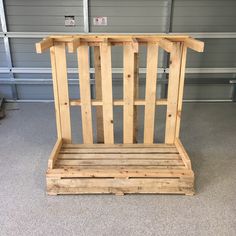 a wooden bench made out of pallets in a garage