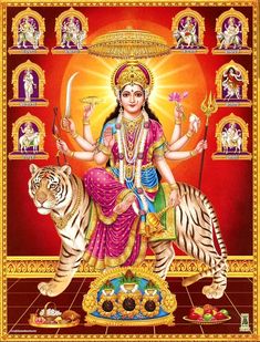 the hindu goddess sitting on top of a tiger