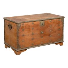 an old wooden chest with metal studs on the front and sides, isolated against a white background