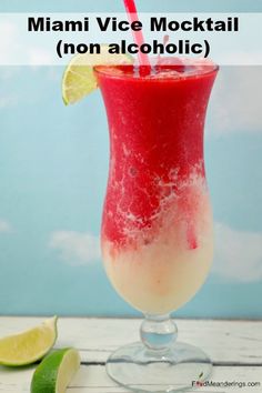 a red drink in a glass with limes around it and the words miami vice cocktail non alcoholic