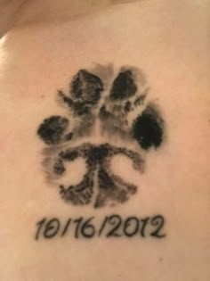 a person with a paw print on their chest and the date 2012 written in black ink