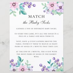 a baby shower game with flowers and leaves on the front, which reads match the baby locks