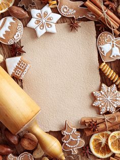 an assortment of christmas cookies and decorations on a wooden background with space for text or image