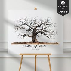 an easel with a tree on it in front of a white wall