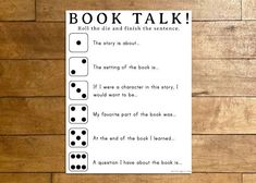 a book talk sheet with black and white dices on it, next to a wooden wall