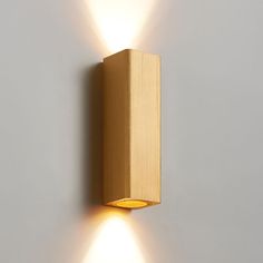 a wall light with two lights on it