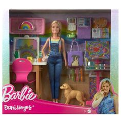 barbie doll with blonde hair and blue overalls standing in front of her play room