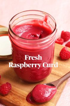 fresh raspberry curd in a jar with spoon